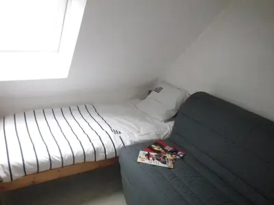 Un ou plusieurs lits dans un hébergement de l'établissement Charmant duplex avec belle vue mer la plage à 100 m