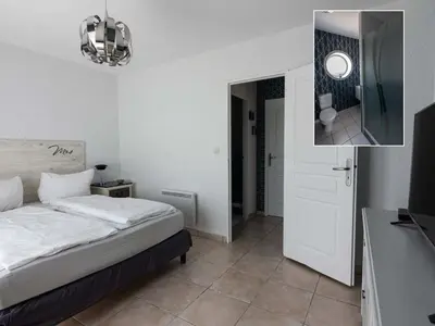 Un ou plusieurs lits dans un hébergement de l'établissement DUXCAAR Saint Pabu Comfortable holiday residence
