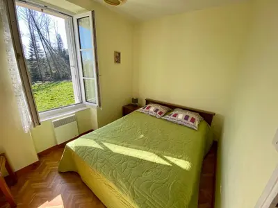 Un ou plusieurs lits dans un hébergement de l'établissement Maison à la Campagne à Melgven