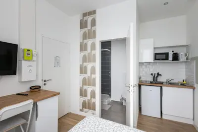Cuisine ou kitchenette dans l'établissement Le Vigilant