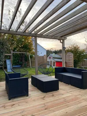 Jardin de l'établissement Charmante maison proche de la mer et des commerces