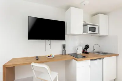 Cuisine ou kitchenette dans l'établissement L'Ankou