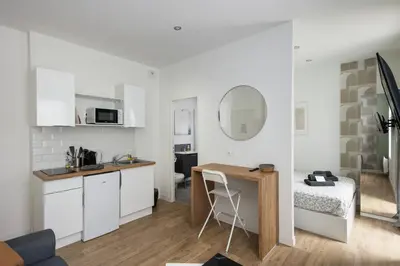 Cuisine ou kitchenette dans l'établissement Le Triomphant