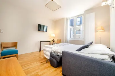 Un ou plusieurs lits dans un hébergement de l'établissement Les Résidences d'Armor Ternélia Hôtel-Résidence