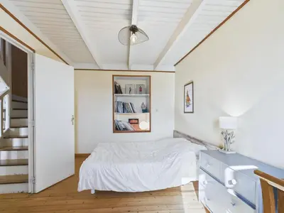 Un ou plusieurs lits dans un hébergement de l'établissement À 400m de la plage, charmante maison pour 7