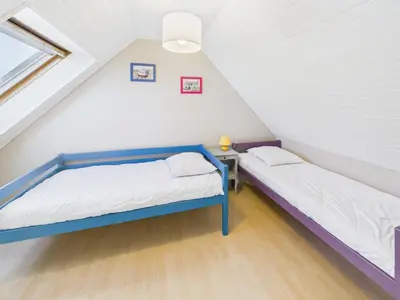 Un ou plusieurs lits dans un hébergement de l'établissement Maison avec veranda pour 6 personnes