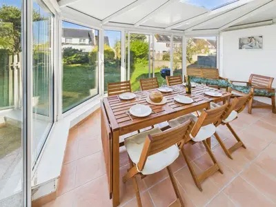 Coin salon dans l'établissement Maison avec veranda pour 6 personnes