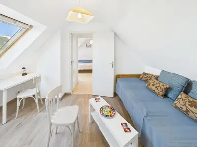 Coin salon dans l'établissement Maison avec veranda pour 6 personnes