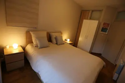 Un ou plusieurs lits dans un hébergement de l'établissement Joli appartement au centre de Brest
