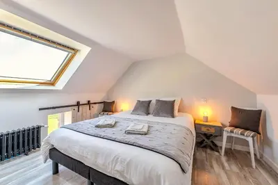 Un ou plusieurs lits dans un hébergement de l'établissement Villa Léonie Maison de vacances 5 chambres près de la plage à Kerlouan