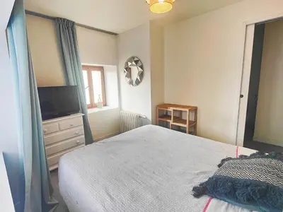 Un ou plusieurs lits dans un hébergement de l'établissement Le studio - La maison de la côte des légendes