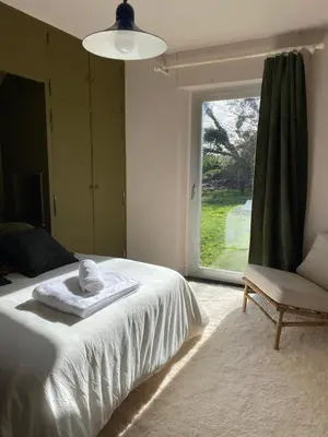 Un ou plusieurs lits dans un hébergement de l'établissement Villa Les Pieds dans l'Eau