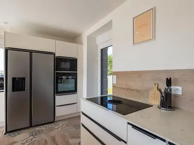 Cuisine ou kitchenette dans l'établissement Holiday Home La Maison de Parrain by Interhome