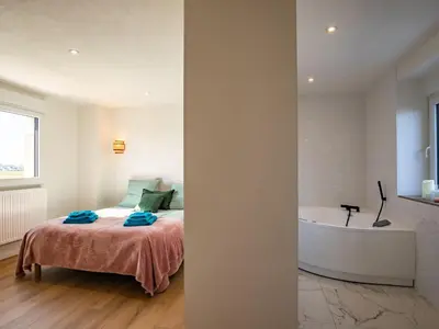 Un ou plusieurs lits dans un hébergement de l'établissement Holiday Home La Maison de Parrain by Interhome