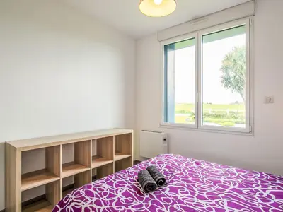 Un ou plusieurs lits dans un hébergement de l'établissement Holiday Home Le Nid Marin by Interhome
