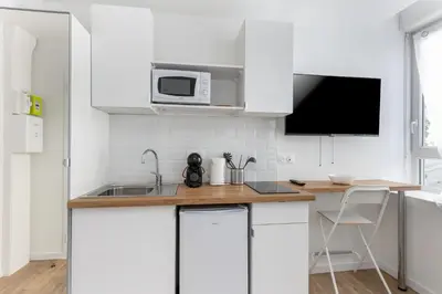 Cuisine ou kitchenette dans l'établissement Fée Viviane