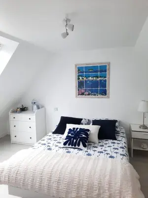 Un ou plusieurs lits dans un hébergement de l'établissement Chambre d'hôtes avec petit-déjeuner