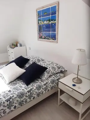 Un ou plusieurs lits dans un hébergement de l'établissement Chambre d'hôtes avec petit-déjeuner