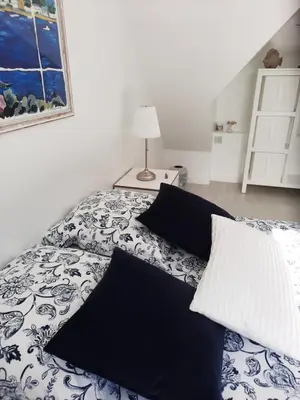Un ou plusieurs lits dans un hébergement de l'établissement Chambre d'hôtes avec petit-déjeuner