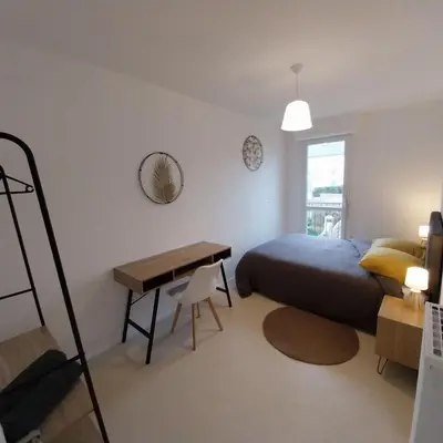 Un ou plusieurs lits dans un hébergement de l'établissement Maison de ville proche de tout, 5min du centre ville & 20min de la plage