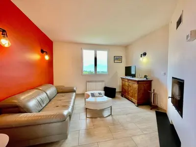 Coin salon dans l'établissement Maison de famille Henvic