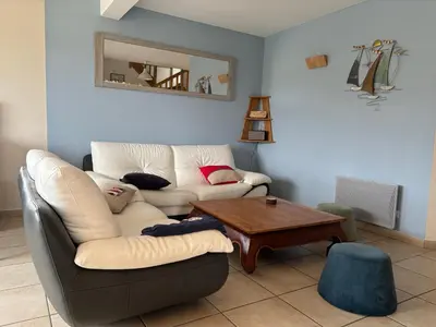 Coin salon dans l'établissement Maison bord de mer