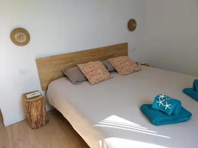 Un ou plusieurs lits dans un hébergement de l'établissement Séjour cosy proche mer- la Torche- spot surf