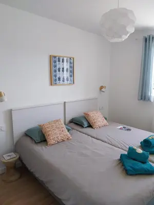 Un ou plusieurs lits dans un hébergement de l'établissement Séjour cosy proche mer- la Torche- spot surf
