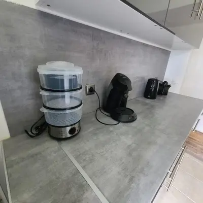 Cuisine ou kitchenette dans l'établissement Appartement Morlaix pres de la gare avec 2 chambres et Internet