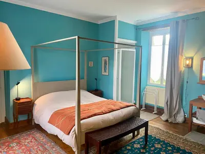 Un ou plusieurs lits dans un hébergement de l'établissement B&B Manoir de Keryvon