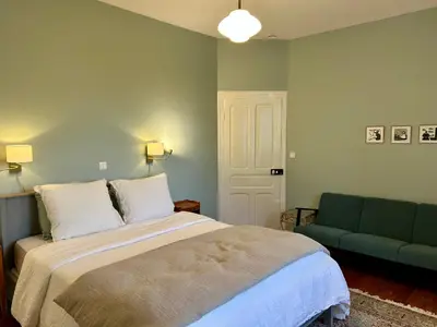 Un ou plusieurs lits dans un hébergement de l'établissement B&B Manoir de Keryvon