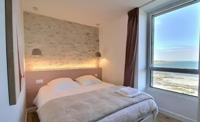 Un ou plusieurs lits dans un hébergement de l'établissement Santec, T3 duplex, face à la mer