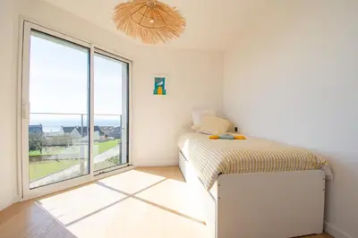 Un ou plusieurs lits dans un hébergement de l'établissement L'Horizon Bleu I Vue panoramique sur la mer