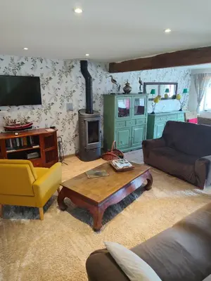 Télévision ou salle de divertissement dans l'établissement Location de La Ferme De Kerraoul