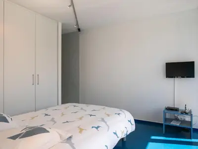 Un ou plusieurs lits dans un hébergement de l'établissement Holiday Home Villa de la Baie by Interhome