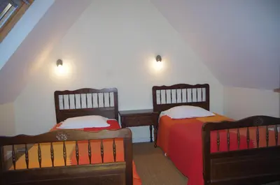 Un ou plusieurs lits dans un hébergement de l'établissement Gîtes du Manoir de Goandour