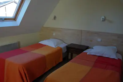 Un ou plusieurs lits dans un hébergement de l'établissement Gîtes du Manoir de Goandour
