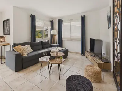 Coin salon dans l'établissement Maison avec terrasse et jardin pour 6 - Bénodet