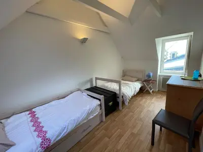 Un ou plusieurs lits dans un hébergement de l'établissement Villa d'exception WaterWorld Ile Tudy les pieds dans l'eau