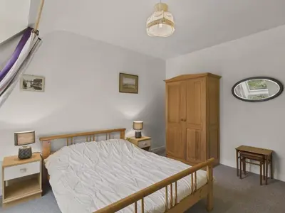 Un ou plusieurs lits dans un hébergement de l'établissement Maison avec jardin pour 8 adultes et 2 enfants
