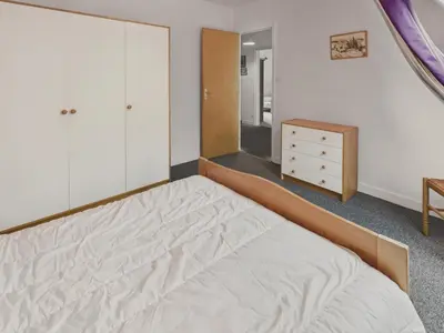 Un ou plusieurs lits dans un hébergement de l'établissement Maison avec jardin pour 8 adultes et 2 enfants