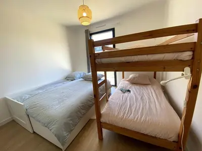 Un ou plusieurs lits dans un hébergement de l'établissement Villa Armor Vue mer et Spa