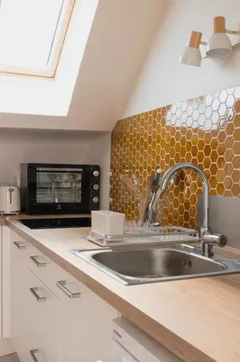 Cuisine ou kitchenette dans l'établissement Résidence du Steir - T2