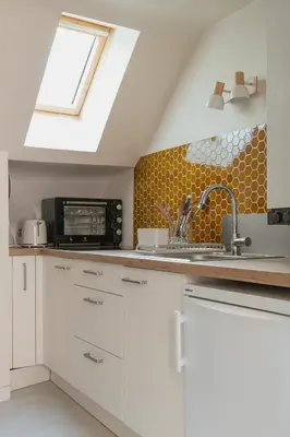 Cuisine ou kitchenette dans l'établissement Résidence du Steir - T2