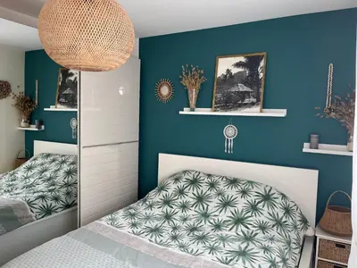 Un ou plusieurs lits dans un hébergement de l'établissement Maison bonheur