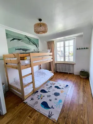 Un ou plusieurs lits dans un hébergement de l'établissement Au calme, maison en pierres proche de la plage