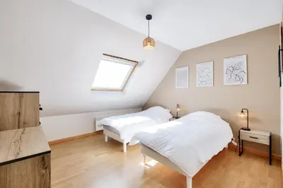 Un ou plusieurs lits dans un hébergement de l'établissement Maison pour 6 avec jardin à 500 m de la plage