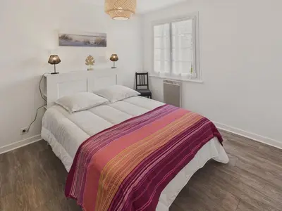 Un ou plusieurs lits dans un hébergement de l'établissement Appartement pour 4 à 5 minutes de la plage