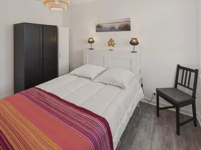 Un ou plusieurs lits dans un hébergement de l'établissement Appartement pour 4 à 5 minutes de la plage