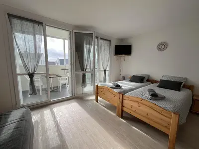 Un ou plusieurs lits dans un hébergement de l'établissement Studio spacieux, proche mer et thalasso, parking privé